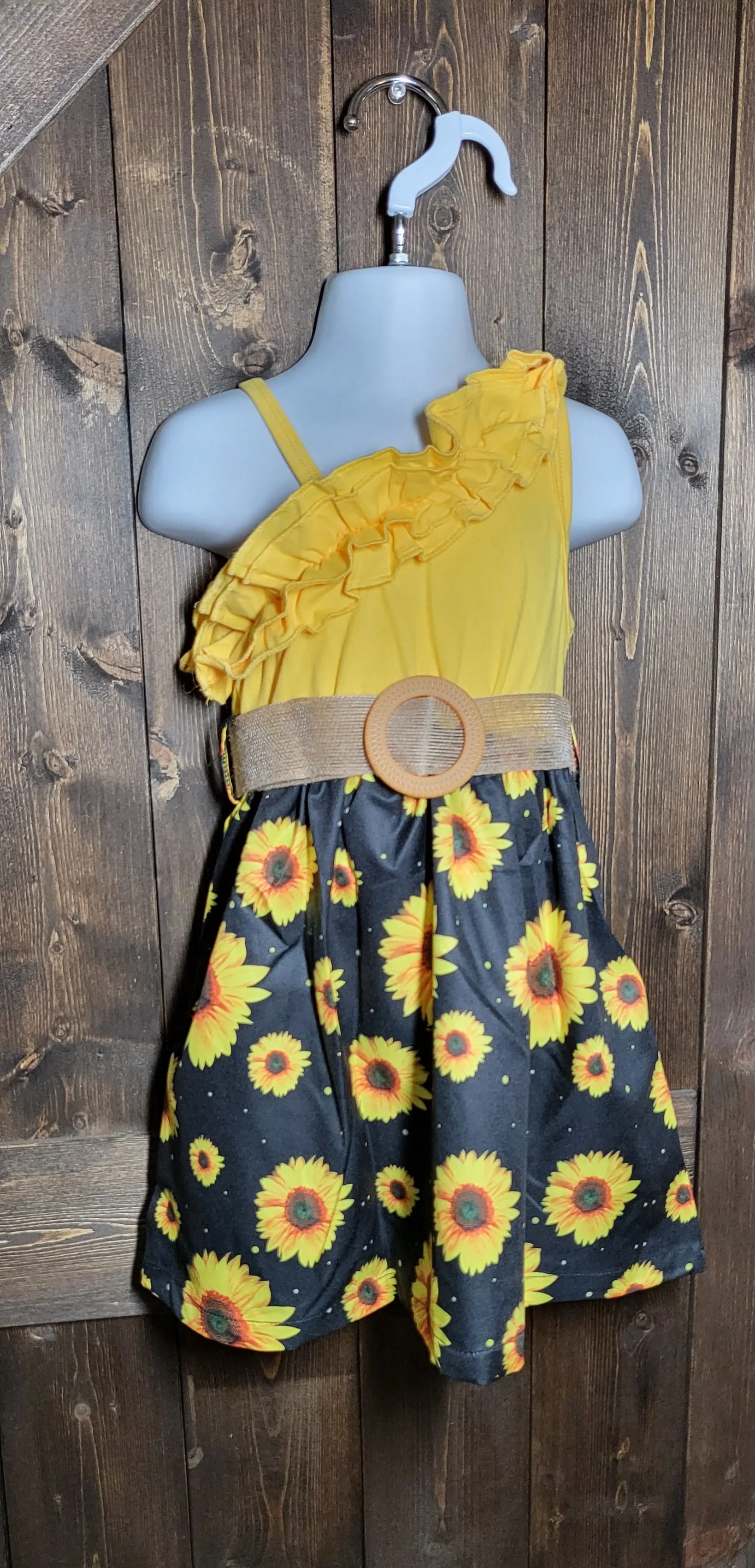 Adorable girls dresses in cowprint, sunflower, and watermelon with a cropped jean jacket